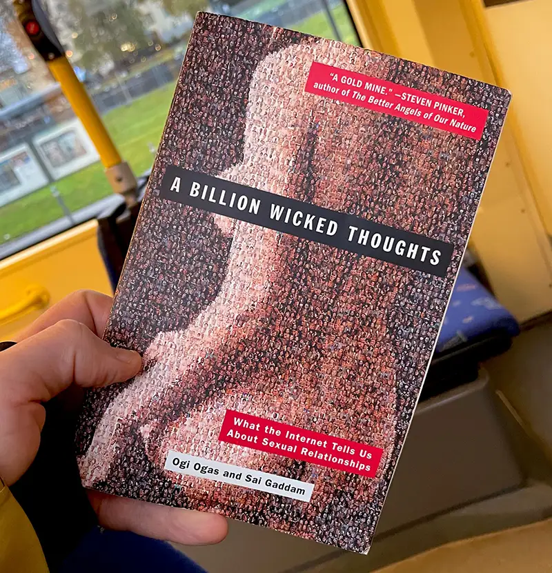 A Billion Wicked Thoughts book cover held in hand